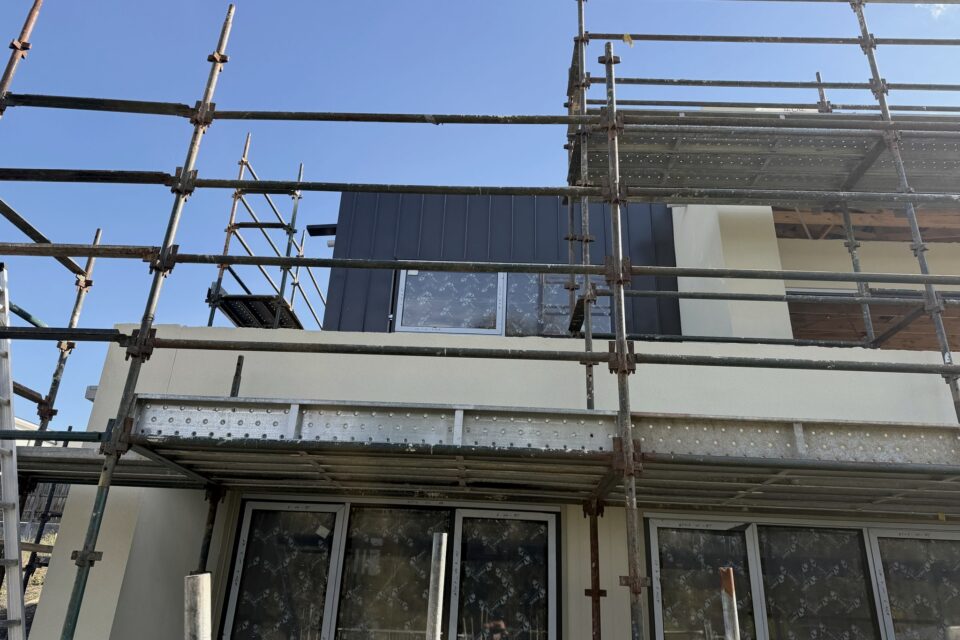 A partly completed two storey home still under scaffold, photographed during a Site Inspections inspection