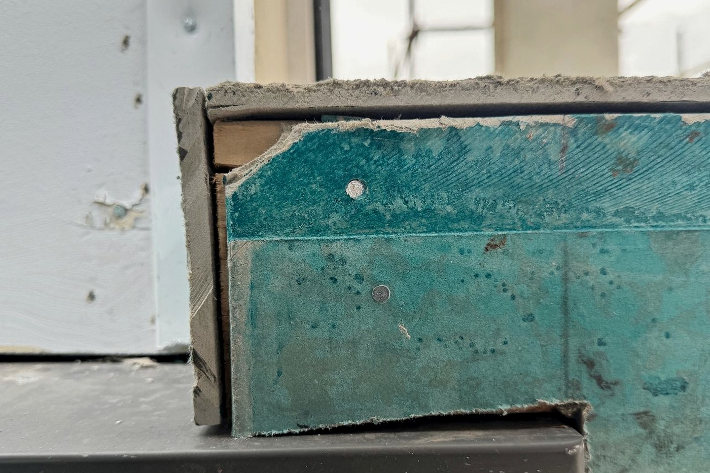 Damaged and delaminating cladding sheet edge