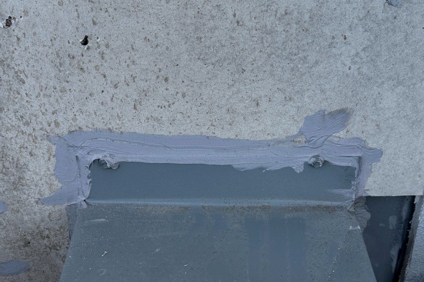 Poorly formed flashing detail at a roof junction